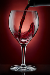 Pouring red wine
