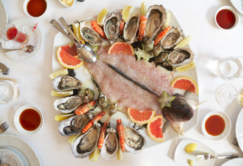 Platter with oysters and seabass carpaccio