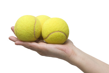 hand and tennis balls