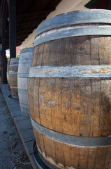 Barrels by old saloon in San Diego