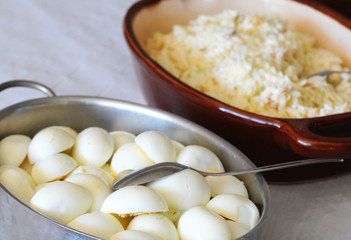 Dish of eggs cut in half with spoon