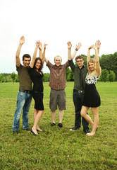 Obraz premium friends keep hands up outdoor