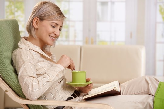 Woman reading with coffee
