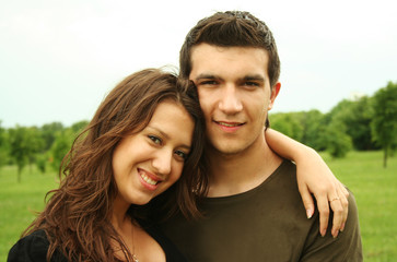 young man and girl embracing outdoor