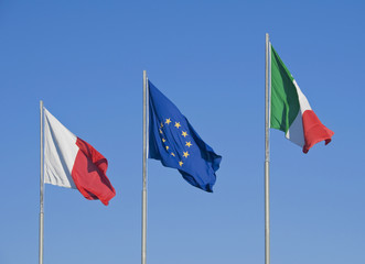 Flags on blue sky.