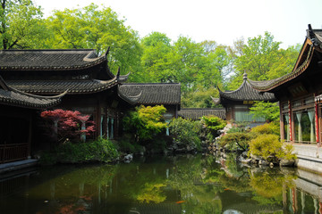 Old oriental structures with garden and fish pond