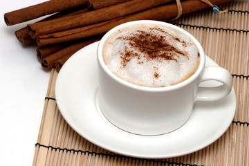 cappuchino and cinnamon sticks