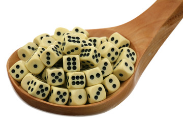 Dice in a wooden spoon