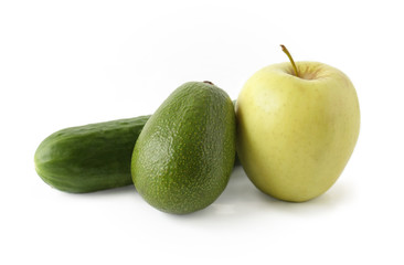 Apple avocado and cucumber on a white background