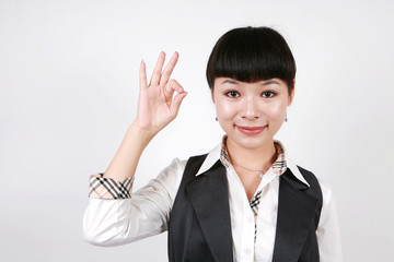Businesswoman giving thumbs up for approval