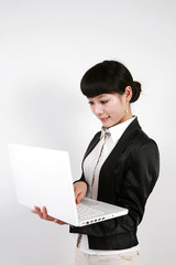 Businesswoman and portable computers on white