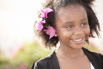 Image of a child with flowers in her hair
