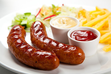 Grilled sausages and vegetables