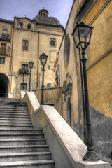 Fototapeta na wymiar Ancient stairway to a church with lanterns