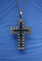 Cross necklace on  blue shirt