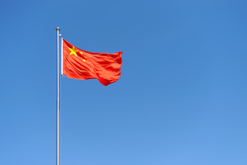 Flag of China against clear blue sky