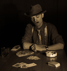 old style gambler with cigar and glass