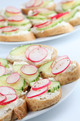 Appetizers with cream cheese, radish and cucumber