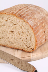 Loaf of fresh bread on cutting board