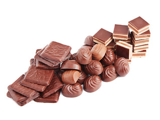 different chocolate candies isolated on white.