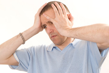 frustrated man in a blue  on a white