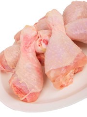 Fresh raw chicken legs. Close up on white background