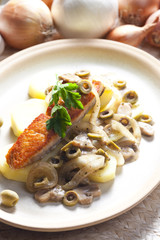 baked salmon on champignons, onion and olives