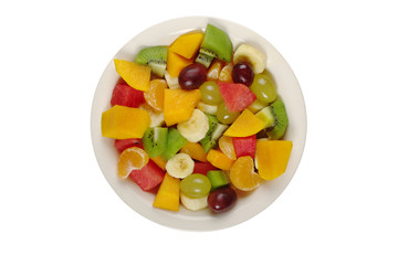 Tropical fruit salad on white plate