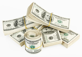 Many  bundle and roll of US 100 dollars bank notes