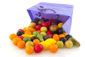 Colorful candy in purple bag