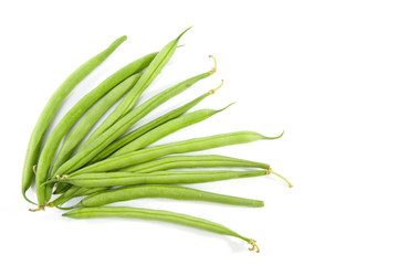 raw long green beans over white background