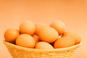 Basket of eggs on the colourful background