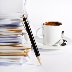 coffee and stack of paper