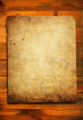 grunge paper on wood plank