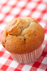 muffin on checkered tablecloth