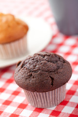 muffin on checkered tablecloth