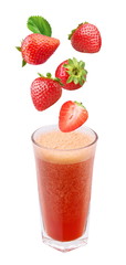 strawberry falling into a glass of fresh juice