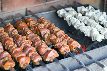 raw kebab, meat and fish on a grill, barbecue