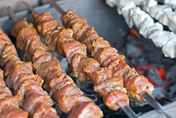 raw kebab, meat and fish on a grill, barbecue