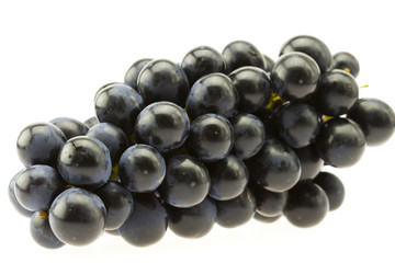 bunch of blue grapes isolated on white
