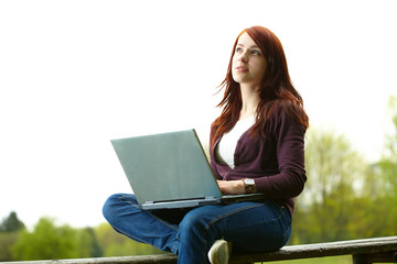 The girl with laptop on outdoor