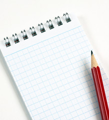 Blank notepad with graphitic pencil