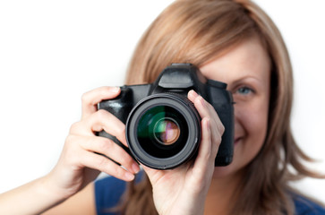 Attractive woman using a camera