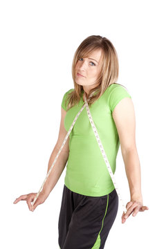 Woman with tape around neck shrugging
