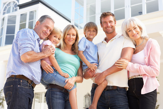 Extended Family Outside Modern House