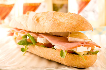 Sandwich with ham, tomato, and camembert Cheese