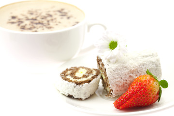 Cappuccino with a sweet roll isolated on white