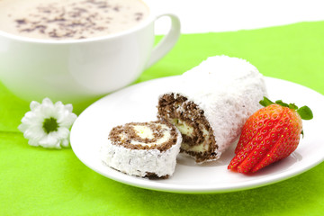 Cappuccino with a sweet roll isolated on white