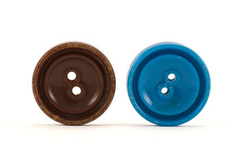 brown and blue clothes buttons ,isolated on white background