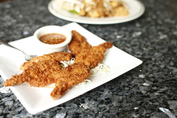 Coconut batter prawns on the table.